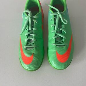 Nike Green Youth Soccer Cleats with Neon Orange Swoosh